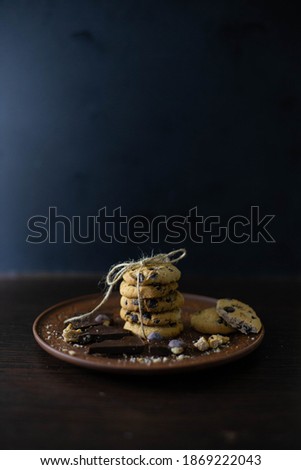 Low key dark food photography with chocolate cookies