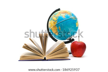 open book, globe and red apple on a white background. horizontal photo.