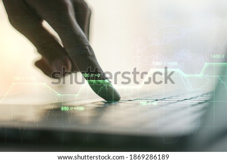 Abstract creative analytics data spreadsheet with hands typing on laptop on background, analytics and analysis concept. Multiexposure
