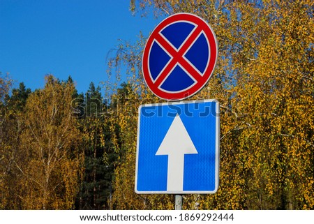 International traffic signs 'No parking stopping' and 'One Way Traffic'