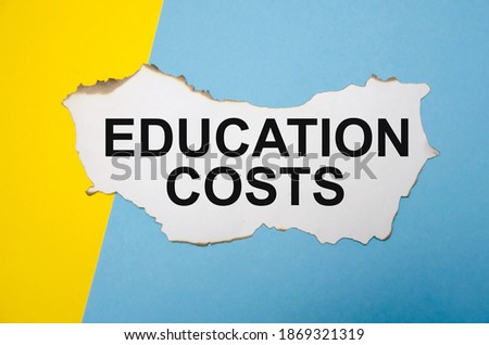  the text education costs is written on a blue-yellow background. High quality photo