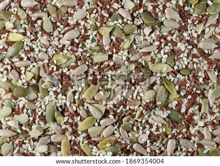 Pile mix seeds, sunflower, sesame, linseed and pumpkin seed background and texture