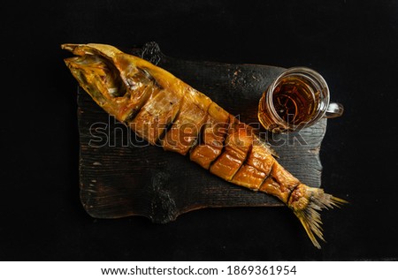 Smoked fish with different items