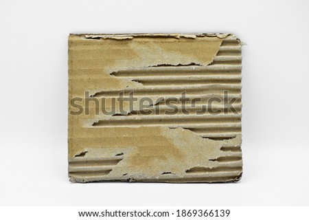 Brown and beige colored corrugated cardboard detail, isolated on white background