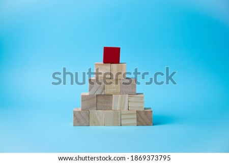 wooden cube stacking as pyramid shape, mock up for create symbol or logo, business growth and management concept