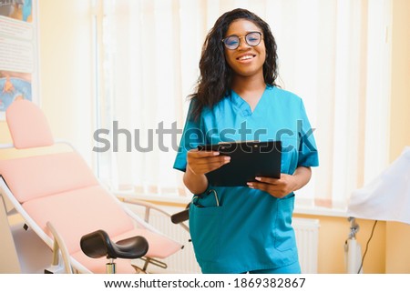 attractive female african american medical professional in office