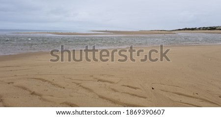 Tides at Cape Cod shoreline beach in Massachusetts.