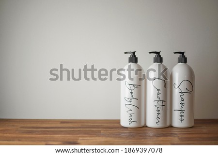 A studio photo of body lotion bottles