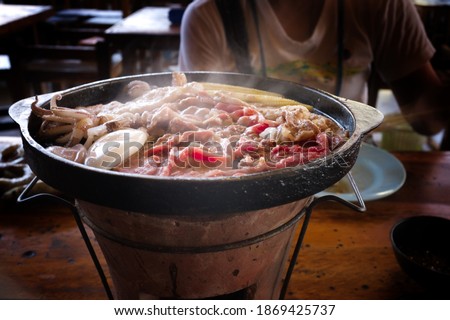 Thai Barbecue or (Moo Kratha) Buffet with Smoke. Cooking Barbecue Thai Style. Picture for Food Concept.