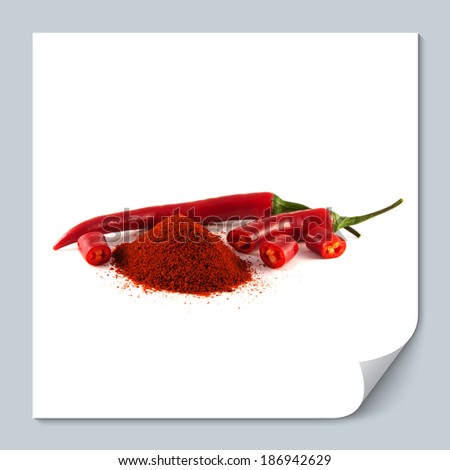 Sliced red chili hot pepper with hill of sweet paprika on white background. Isolated healthy vegetable.