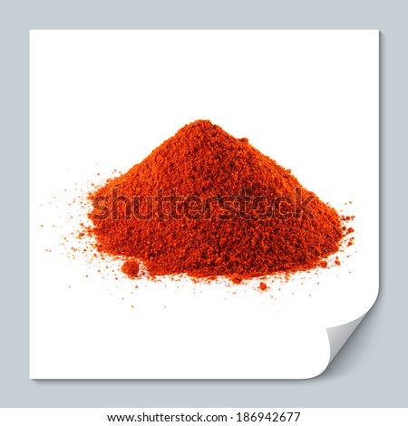 Ground of red chili hot pepper. Hill of sweet paprika on white background. Isolated healthy spicy.