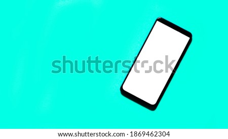 Smartphone on green background top view mockup screen.