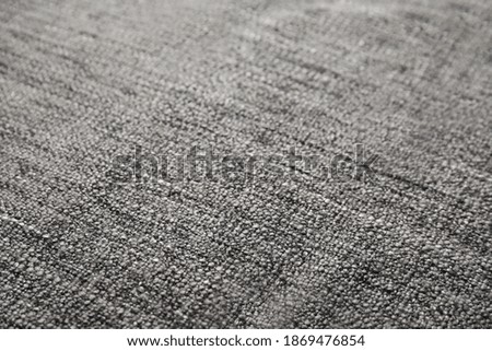 Soft warm grey plaid as background, closeup