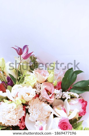 Elegant festive bouquet in pastel colors. Different flowers in one bouquet. Background for greeting cards, invitations.