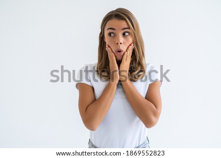 Amazed woman looking at camera isolated on a white background