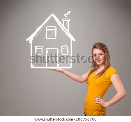 Beautiful young lady holding a huge drawn house