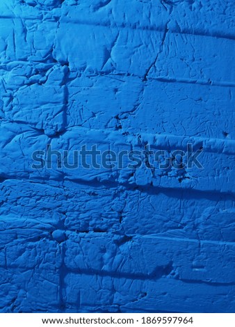 The blue building wall is made as the background