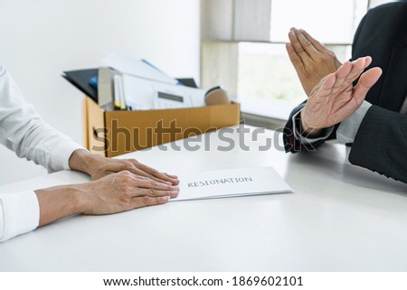 Image of business woman hand sending a resignation letter to his boss and boss refusing, change of job, unemployment, resign concept.