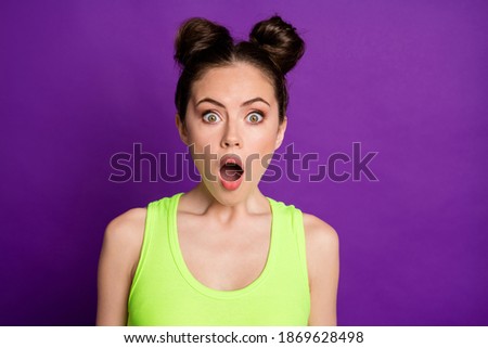 Close-up portrait of nice attractive amazed girl staring eyes news reaction isolated over vibrant violet purple color background