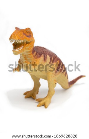 Tyrannosaurus plastic toy in white background