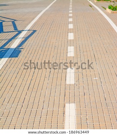 close up of a paved lane on a sunny day