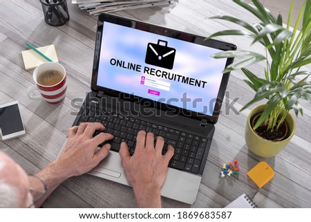 Man using a laptop with online recruitment concept on the screen