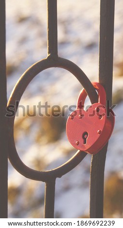  Red iron heart in the form of a lock                              
