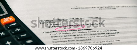 Income statement in stockholder report book. Accounting and financial report analysis. Selective focus, wide banner