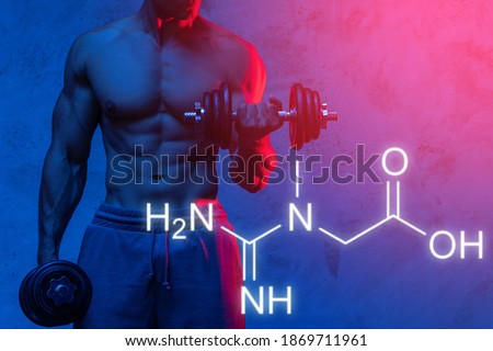 Creatine formula and muscular bodybuilder working out with dumbbells Royalty-Free Stock Photo #1869711961