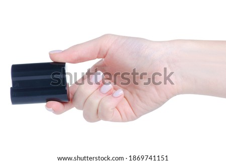 battery for camera in hand on white background isolation