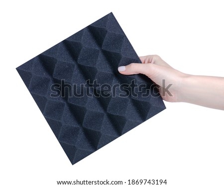 Noise acoustic foam in hand on white background isolation