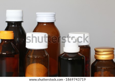 dark-colored medical bottles for storing tablets, capsules, powders, syrup