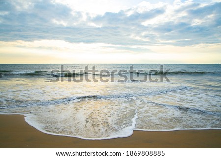 Beautiful waves in the sea on the beach, Tropical beach with cloudy sky, Nature photography, Beach and Ocean Meet Under the cloudy Sky, Beautiful seascape view with sunset