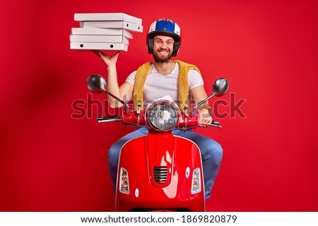 delivery courier man on scooter with driving fast to customers, holding orders boxes food pizza in boxes, on motorbike. quick deliver food to clients, perfect service