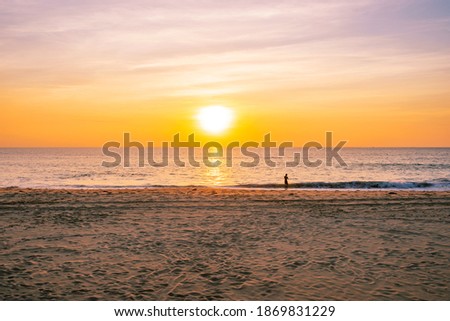 Beautiful sunset or sunrise over the tropical sea on the tropical beach with Sand in the foreground in phuket thailand on December 7,2020.