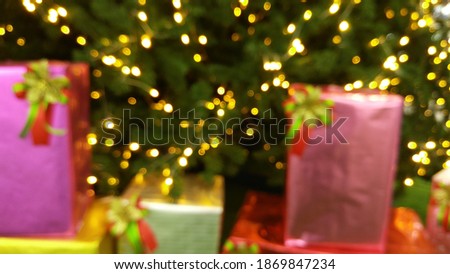 
Blur photos beautiful christmas,with gift boxes ,on trees  bokeh lights,Suitable for use as a background

