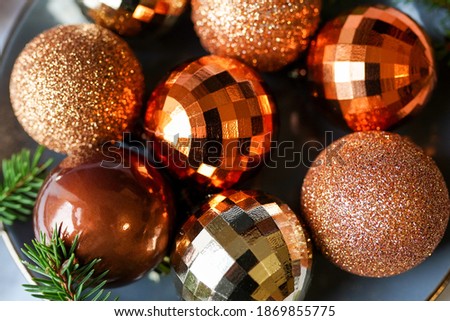 christmas golden balls laying on the gray plate golden christmas card
