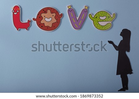 silhouette of a girl on a blue background and love