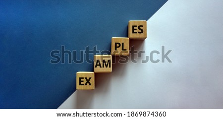 Success process and examples symbol. Wood blocks with word 'examples' stacking as step stair on paper blue and white background, copy space. Business and examples concept. Royalty-Free Stock Photo #1869874360
