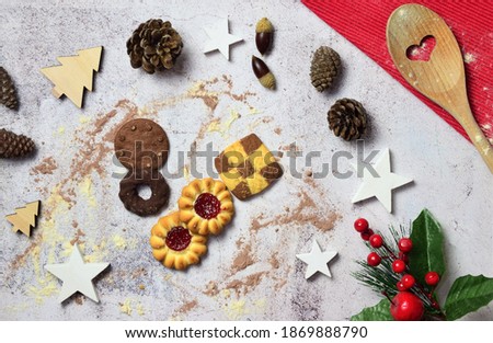 Background with Christmas decoration, on stone with assorted cookies. Merry Christmas