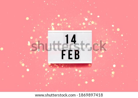 Saint Valentine's day  festive background. Bokeh lights and confetti February 14 . Top horizontal view copyspace. Royalty-Free Stock Photo #1869897418