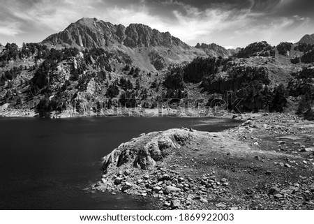 Black and whte scenic landscape with mountain and lake. The photograph taken in Pyrenees Mountain in Catalonia, Spain.