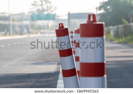 Plastic poles that block the road.