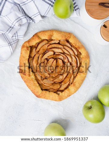 Rustic Apple Tart airy and high lighted mood. With apples on the table