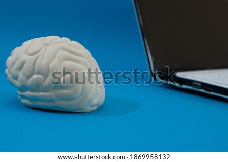 a laptop and an artificial brain, the concept of artificial intelligence, supercomputer, quantum computer