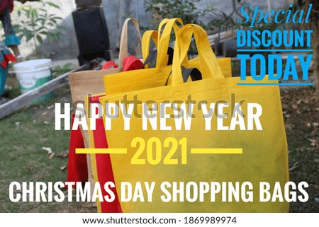Happy New Year 2021 Text on Christmas Shopping Bags. Happy Holidays, Christmas Gift Bags. Special Offer Discount Today Sale Concept. Copy Space with Text and logo