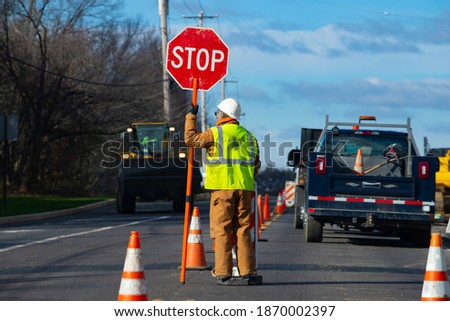 Signs repairs road and worker orange drive