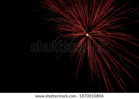 A vibrant red 4th of July fireworks display