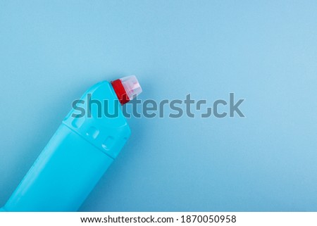 A means for cleaning the toilet and bathroom on a blue background, space for text. concept of cleanliness and cleaning