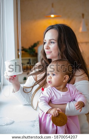 Close up portrait picture of mother holding black baby girl. Concept for family,love, bonding and parenting. single mom. an interracial family. Christmas meeting